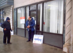 Ariel Reboyras HDO person stands outside of polling place.